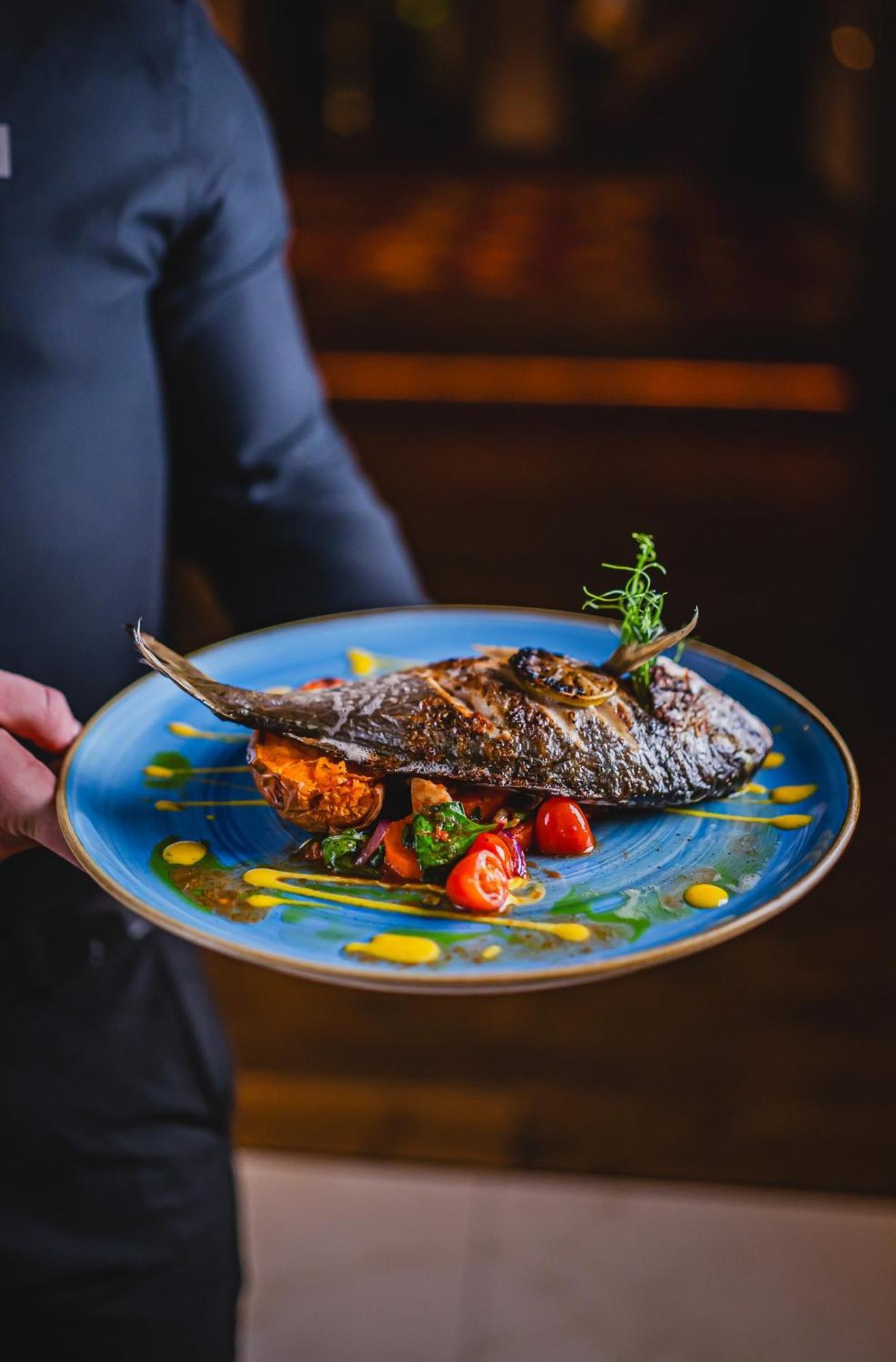 Hotel Bristol Tradition And Luxury Rzeszow Bagian luar foto A prepared fish